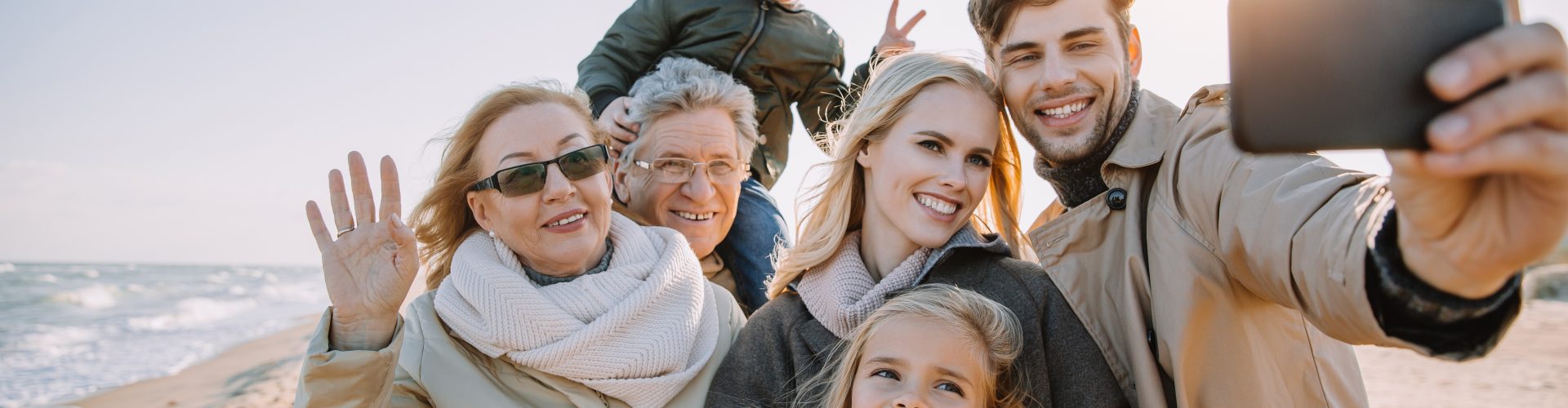 Multigenerational,Family,Taking,Selfie,On,Smartphone,At,Seaside